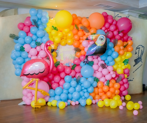 Festive background decoration letters saying one and colored balloons in studio. Baby birthday theme with flamingo. Baby Boy girl. Cake Smash first year concept. Candy bar. photo wall