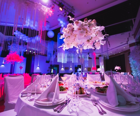 A Grand restaurant and a ballroom in a luxury hotel. The interior design is executed in classical style.